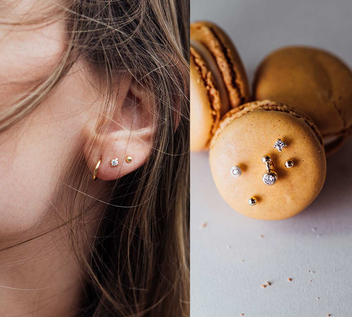 Frauen Ohr mit nachhaltigen Ohrringen und Macaron mit Ohrsteckern