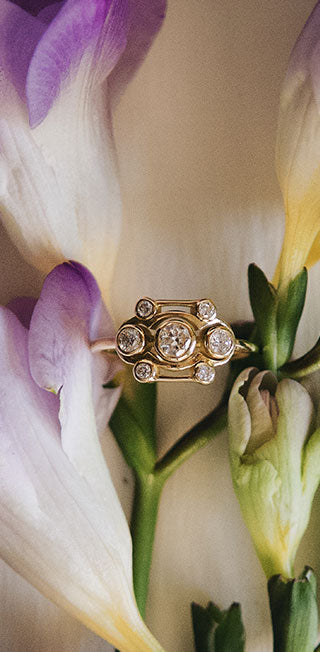 Flower-inspired Art Deco ring by Maren Jewellery in recycled gold and lab-grown diamonds with lily blossoms