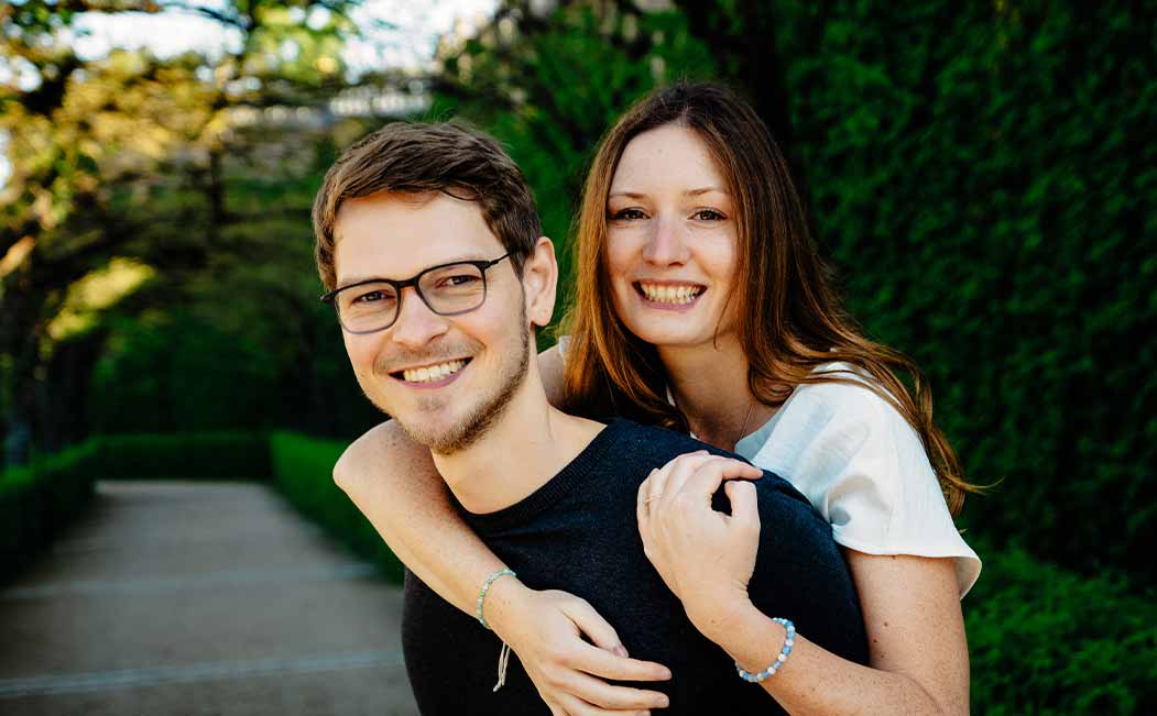 A happy couple shares their engagement story with a sustainable engagement ring from Maren Jewellery